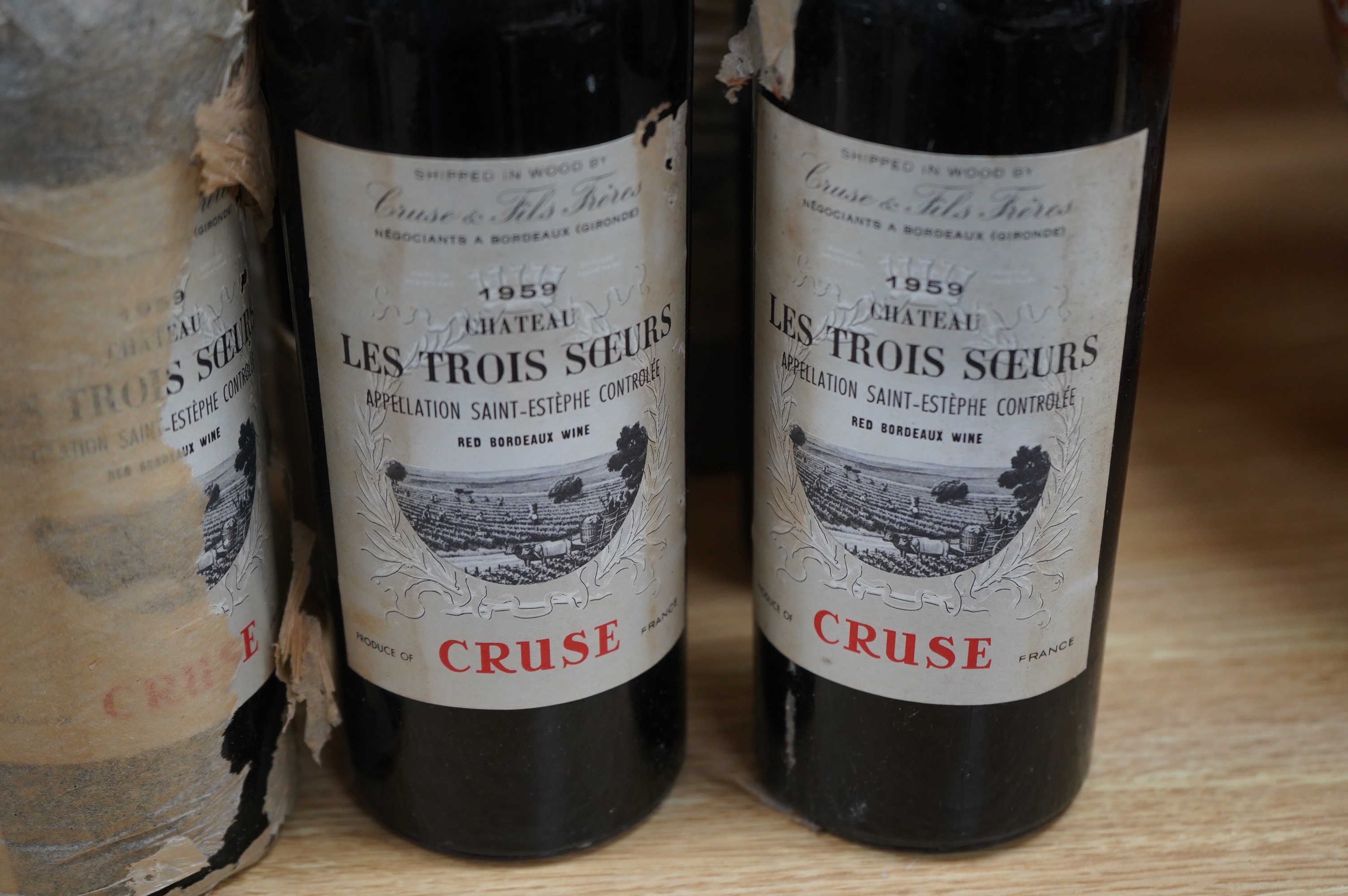 Eleven bottles of Chateau ‘Les Trois Soeurs’ Bordeaux , Cruse. Condition - fair, unknown storage